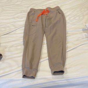 Figs x small set. Small pen stain on lower pant leg